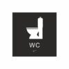 Panneau de toilettes noir et blanc représentant un pictogramme de cuvette de toilettes, avec la mention « WC » sous le symbole et du braille en bas