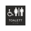Black and white sign for toilet with pictograms of a wheelchair and a woman and a man separated by a vertical line, the text "toilet" is below the symbol and Braille at the bottom